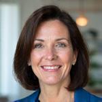 Professional headshot of Dr. Elena Rodriguez, a certified gerontologist and mindfulness instructor